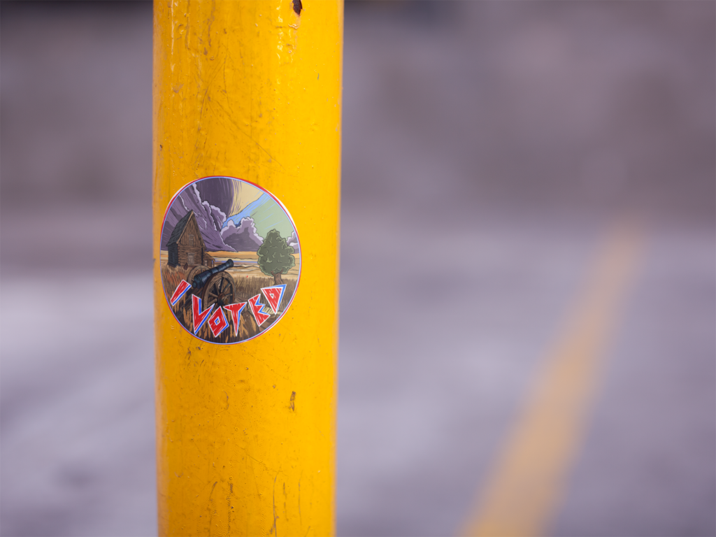 round-sticker-on-a-yellow-pole-in-a-parking-lot-mockup-a14345