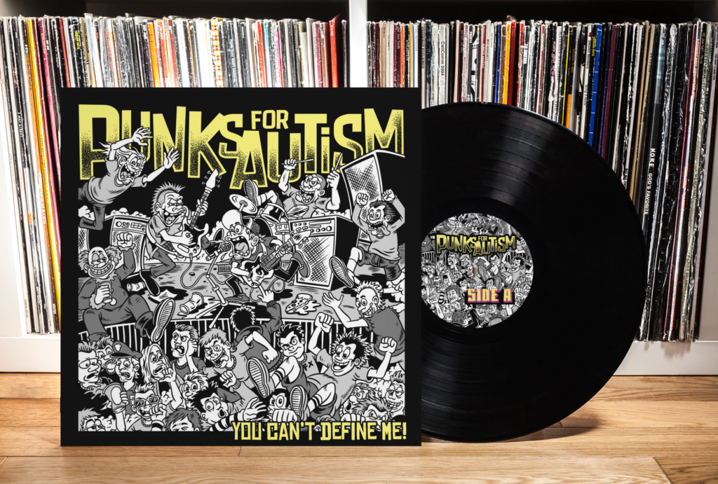 Vinyl record titled Punks for Autism: You Cant Define Me! features black and white cartoon art of people at a concert. The record is displayed in front of shelves filled with more records. The inner label is similar to the album cover art.